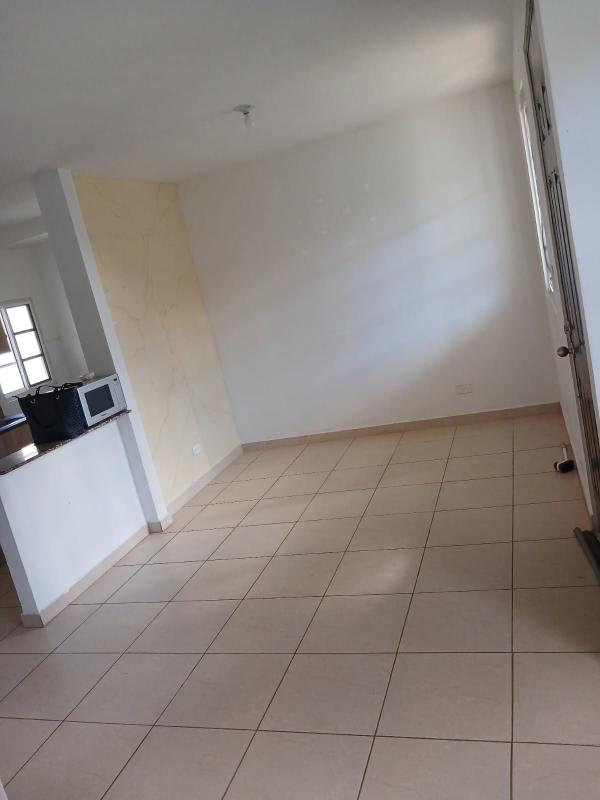 Compact kitchen with granite counters tile floors townhouse Ciudad Santa Fe Pacora