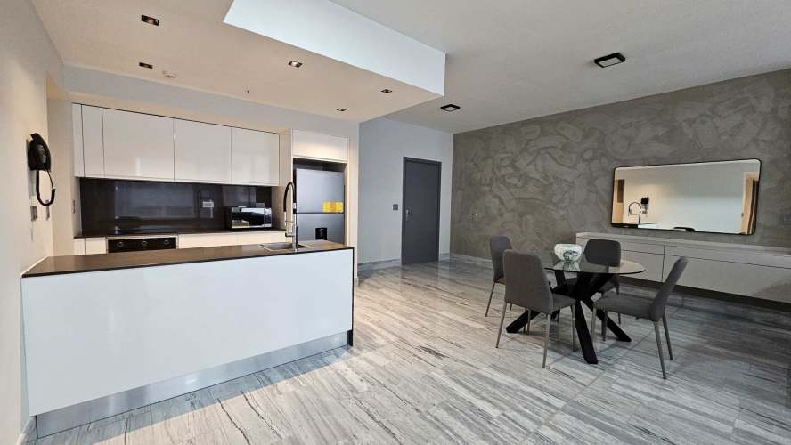 Large second bedroom with city views floor-to-ceiling windows PH BICSA