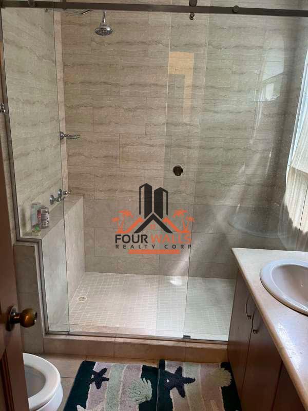 Bedroom featuring AC, ceiling fan, built-in closet and nature view balcony in PH Amador Hill Amador Causeway Panama