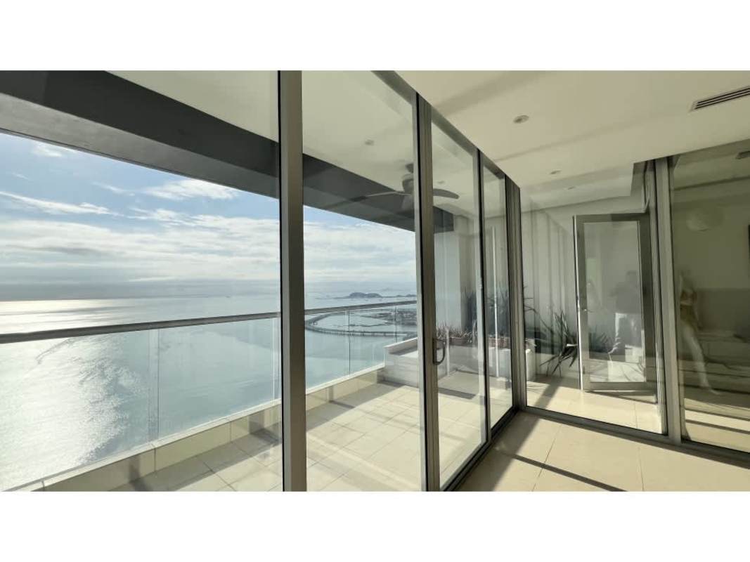 Master bedroom with large window and skyline view at PH Rivage Tower Panama
