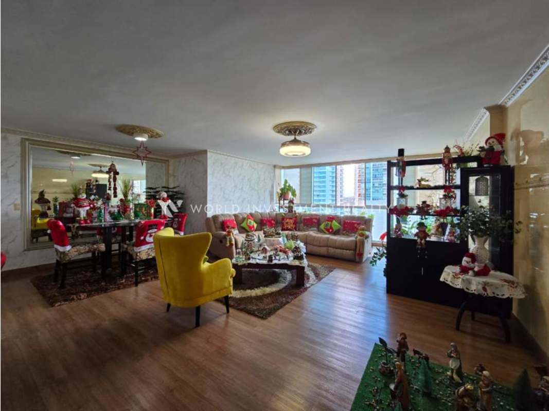 Bright living and dining room with large windows balcony access at PH Costa View Costa del Este Panama