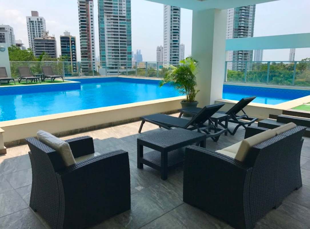 Infinity pool and furnished rooftop lounge with panoramic skyline at PH Parque 22 Panama