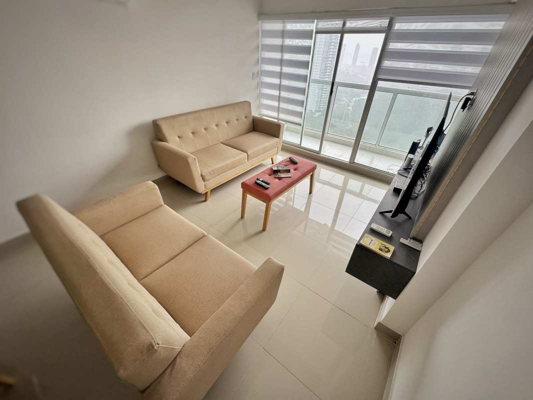 Bright living dining space with large windows, neutral decor PH Parque 22 Panama City