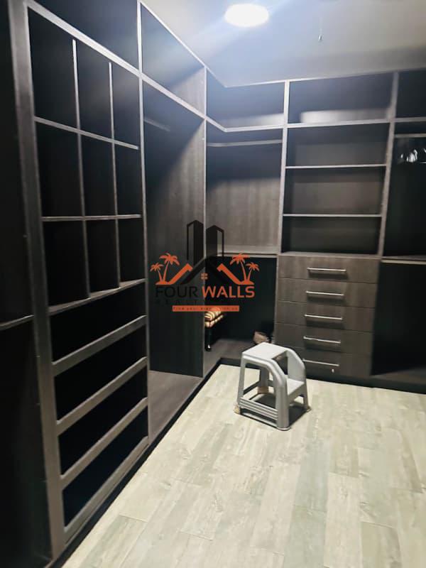 Contemporary hallway with tiles, white doors, glass partitions in Villa de las Fuentes Panama City