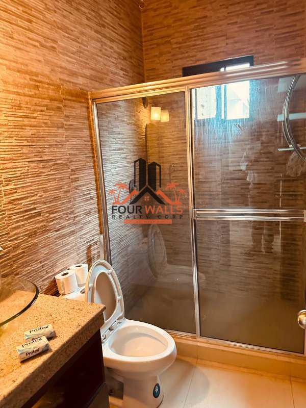 Contemporary bathroom with glass shower, vessel sink and modern fixtures Villa de las Fuentes Panama