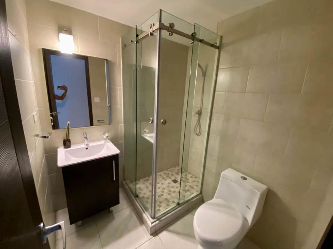 Modern bathroom with glass shower, sink vanity PH BICSA Panama City