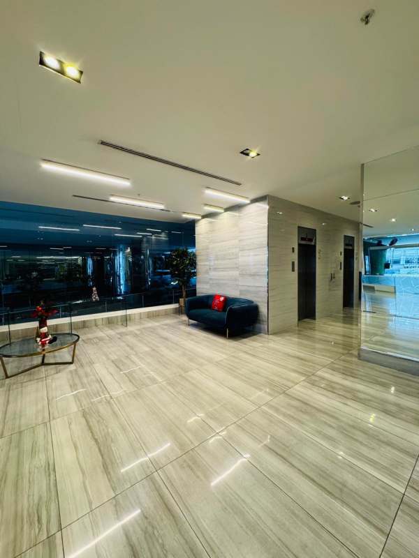 Bright open living space with large mirrored wall, tiled floor, air conditioning in PH Midpark Carrasquilla