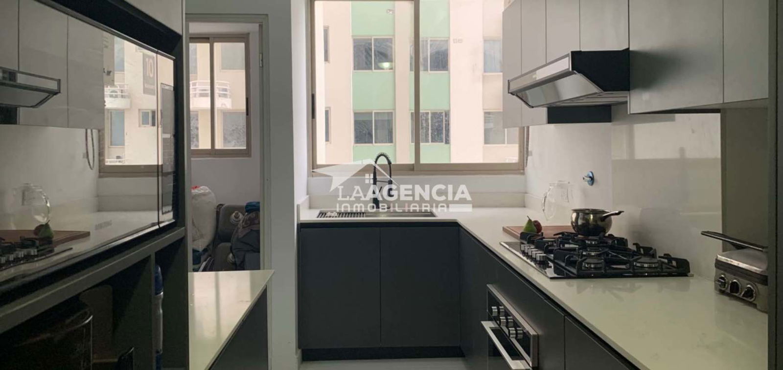 Living room with large panoramic windows overlooking ocean skyline in PH San Francisco Bay