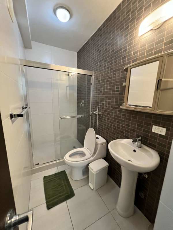 Contemporary bathroom with tile walk-in shower pedestal sink PH Vista Hermosa Panama