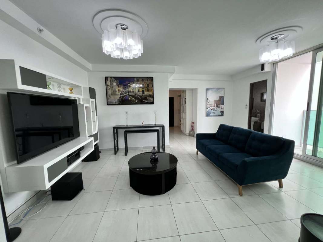 Bright living room with access to balcony and city views in PH Vista Hermosa Tower