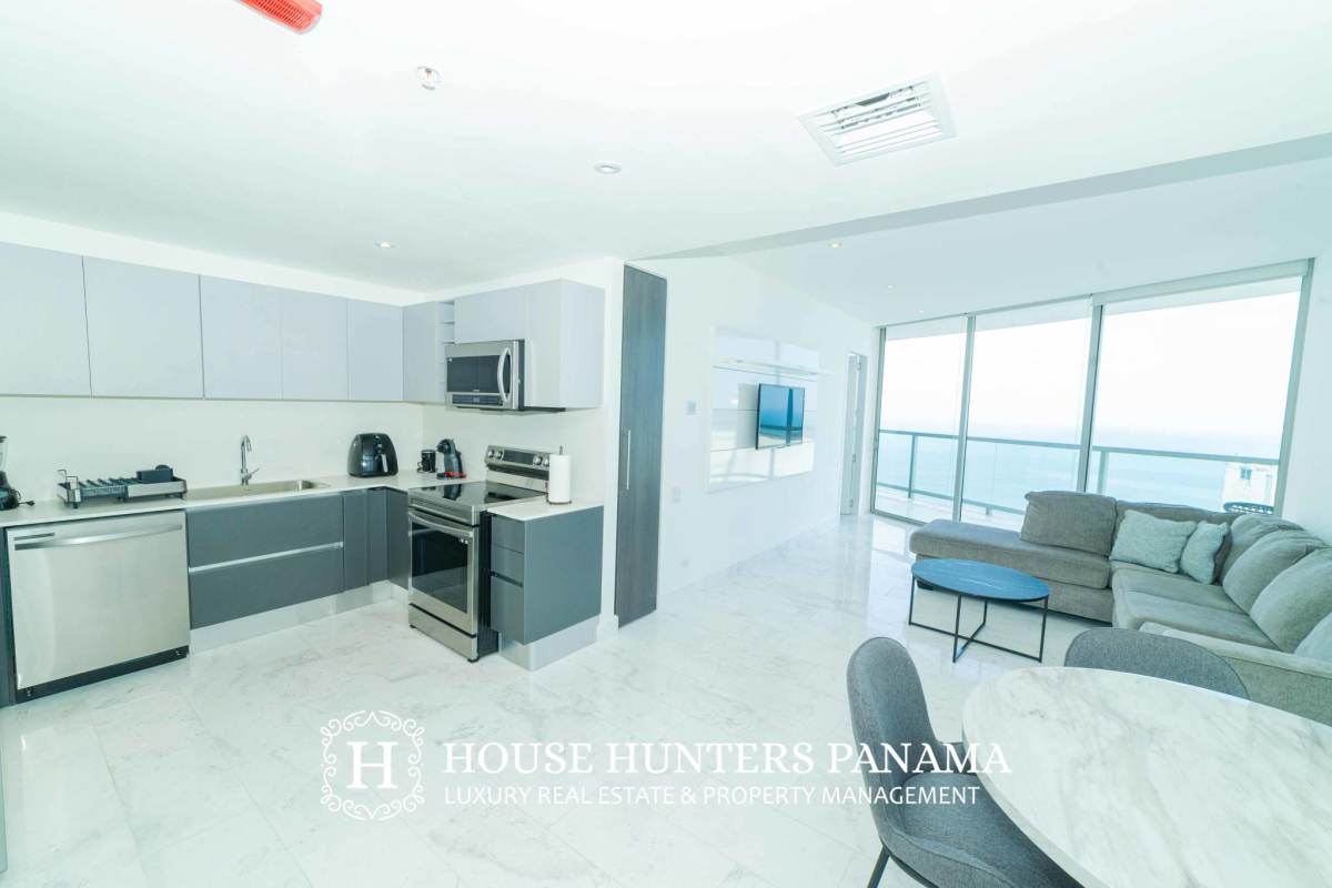 Open plan living dining room ocean view balcony luxury apartment JW Marriott The Ocean Club Panama