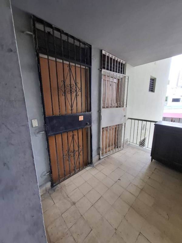 Secure stair access with metal railing and tiled floors in mixed-use building Via España