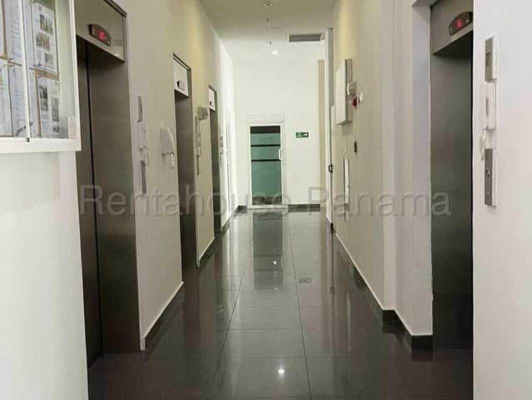 Lobby area with four elevators and porcelain tile floor at PH Kings Park Condado del Rey