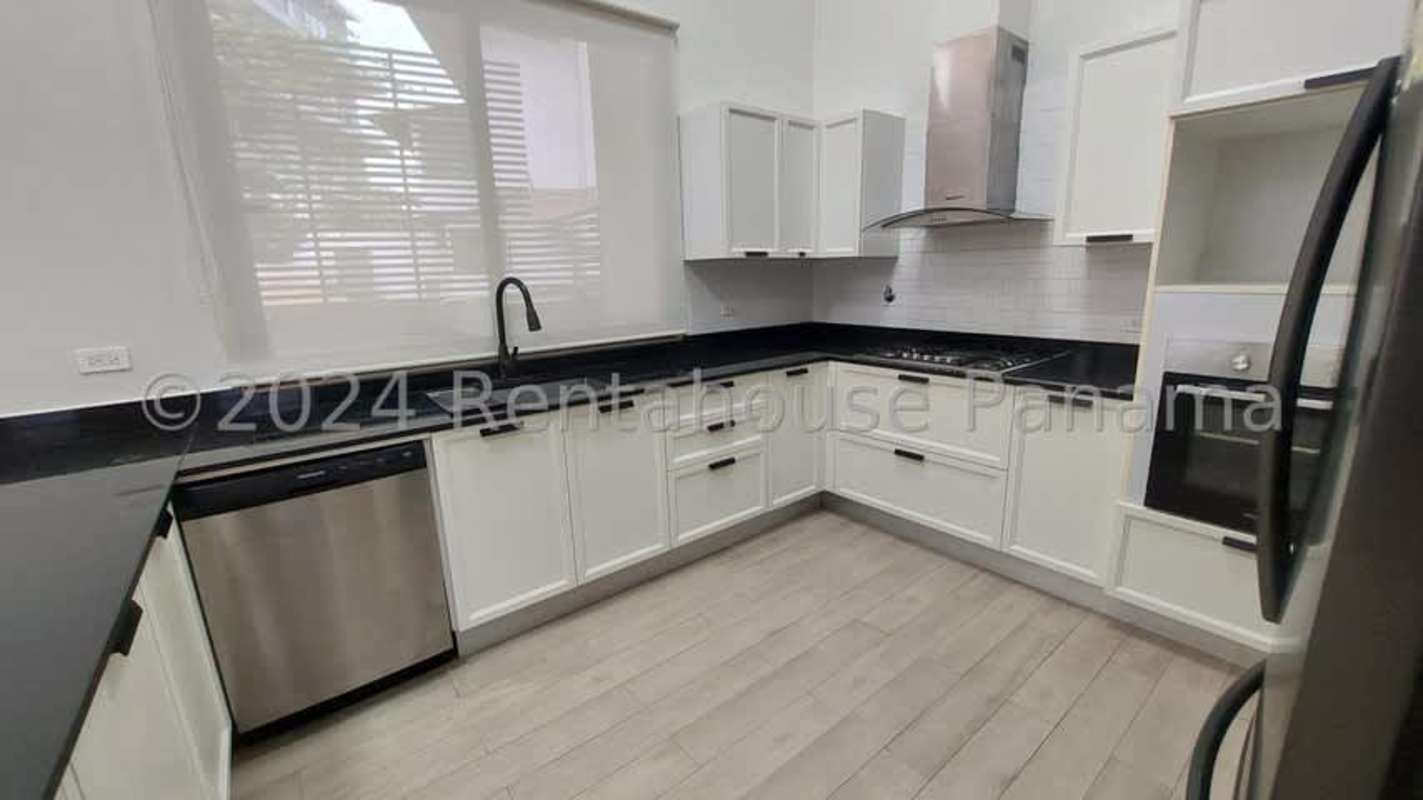 Stylish entry with textured wall and modern staircase in luxury home Panama