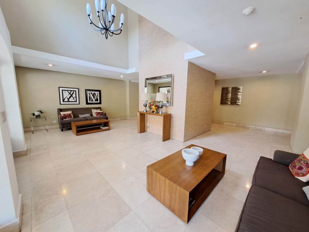 Modern kitchen with granite countertops and dark cabinets at PH Amador Heights Panama City