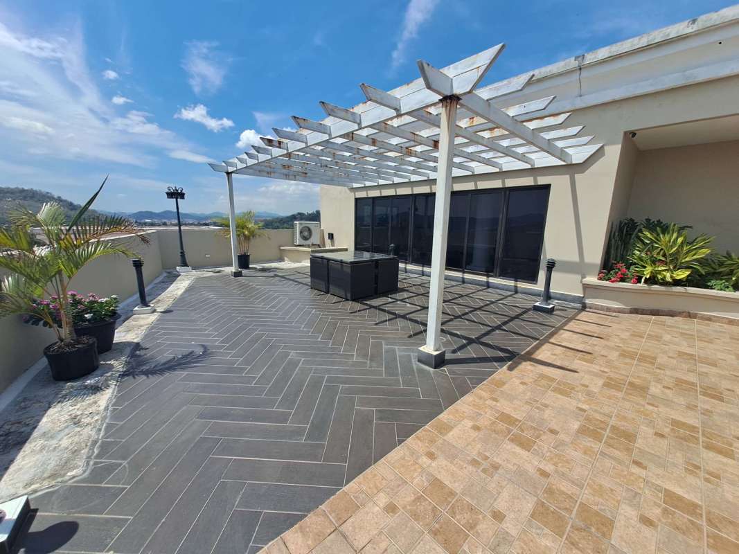 Infinity rooftop swimming pool overlooking ocean and Panama City skyline at PH Amador Heights