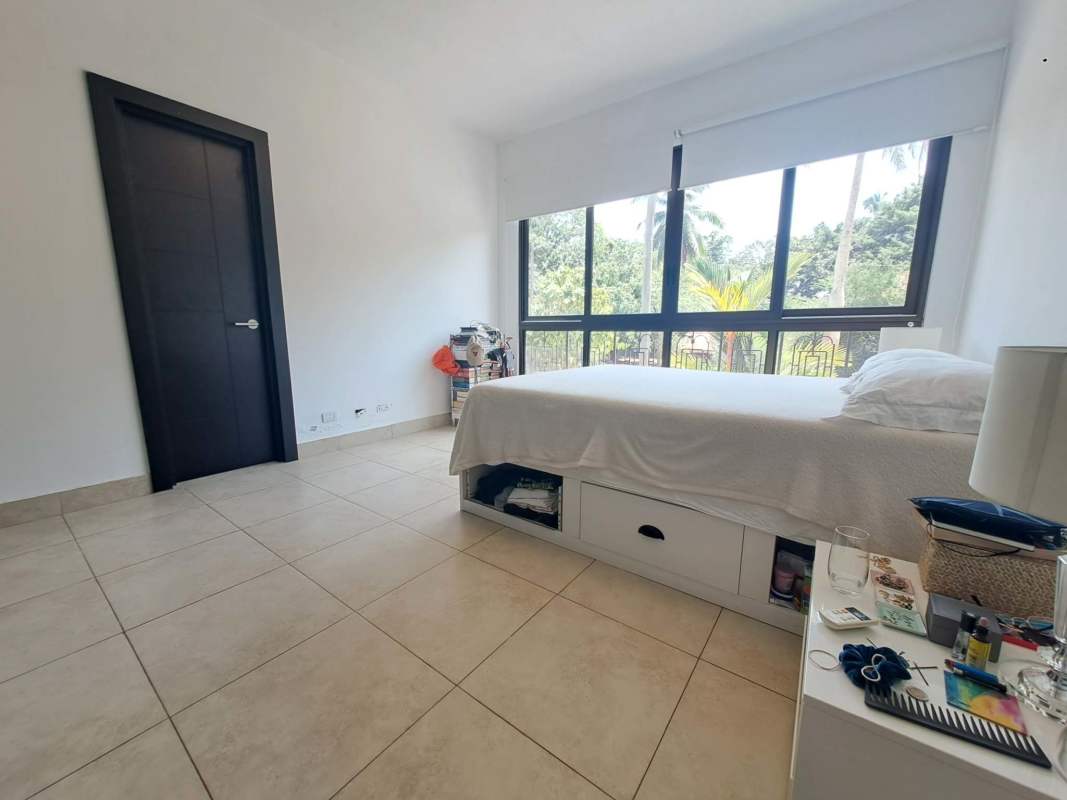 Bright bedroom with ensuite bathroom and built-in closet at PH Amador Heights Panama City