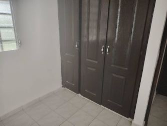 Traditional kitchen with yellow tiled backsplash, gas stove and wood cabinetry Valle Dorado