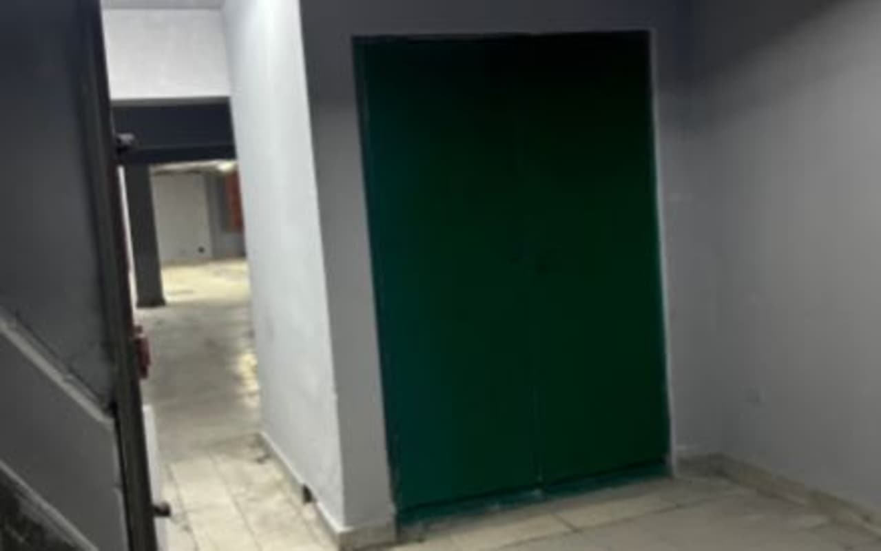 Commercial hallway with green security doors inside warehouse Calidonia Panama