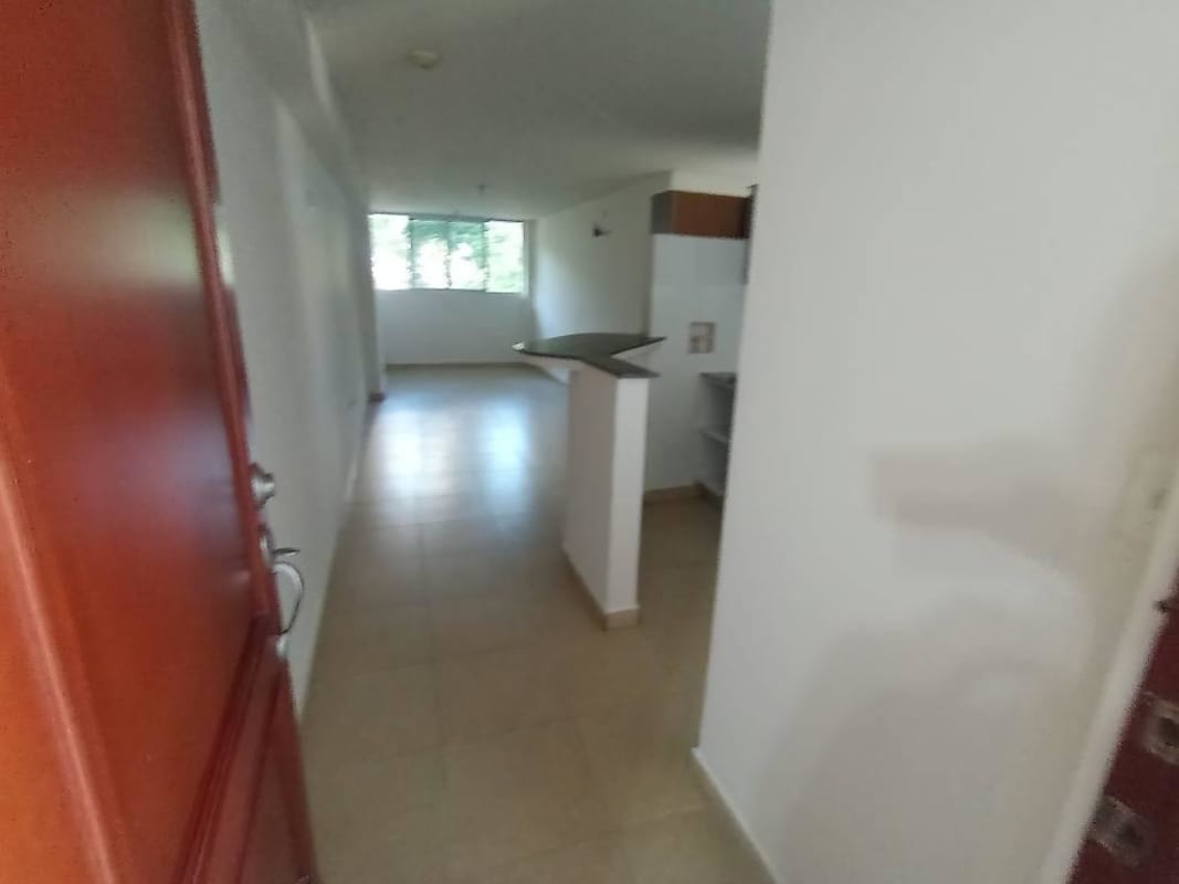 Bright living room with tiled floor and large window La Cresta Panama