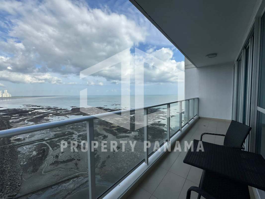 Spacious walk-in closet with built-in wooden cabinets and hanging space in PH Oceanaire Punta Pacifica Panama