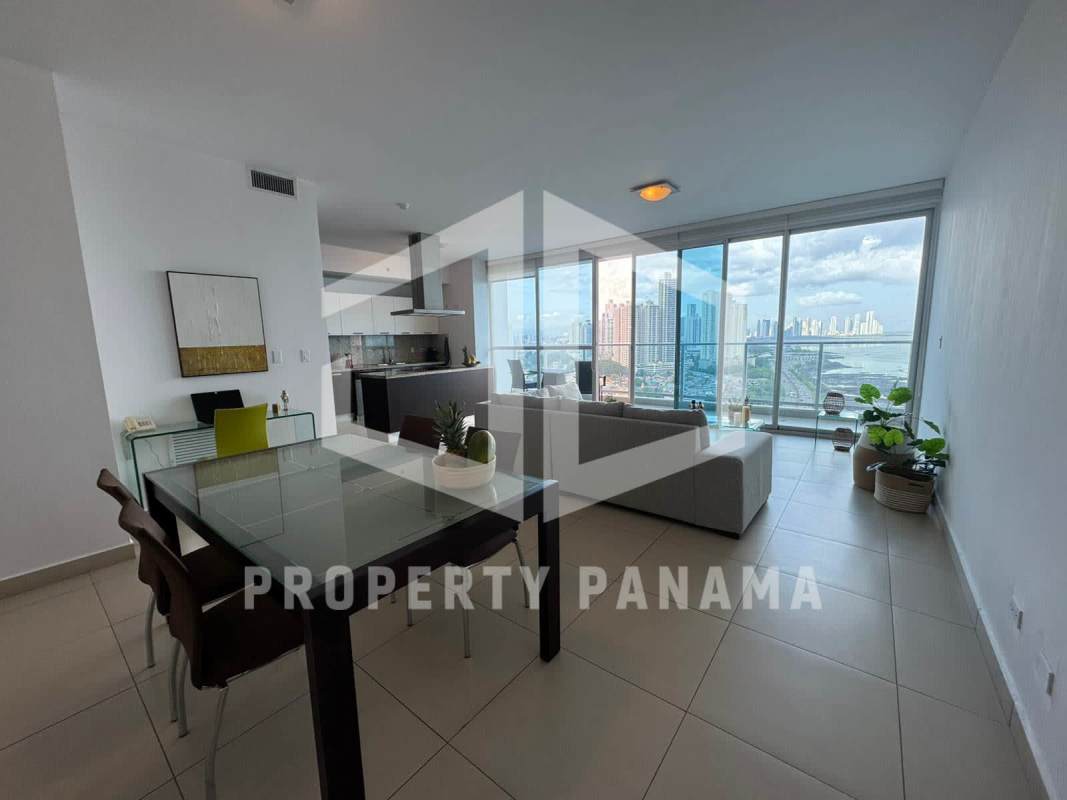 Contemporary living area with panoramic windows showing coastal skyline in PH Oceanaire