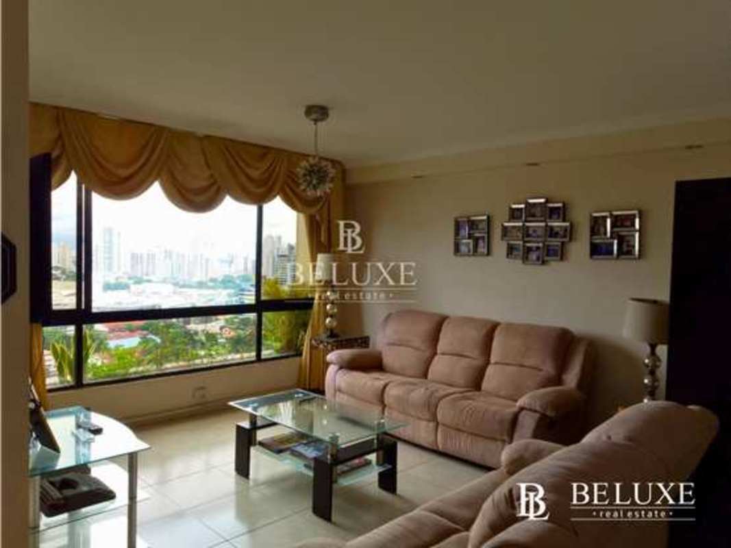 Bright living room panoramic city view sofas glass tables PH Arrecife Punta Paitilla Panama apartment buy