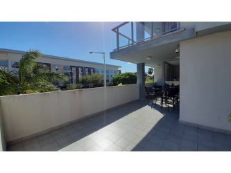 Swimming pool area with gardens in PH Mosaic Panama Pacifico Panama