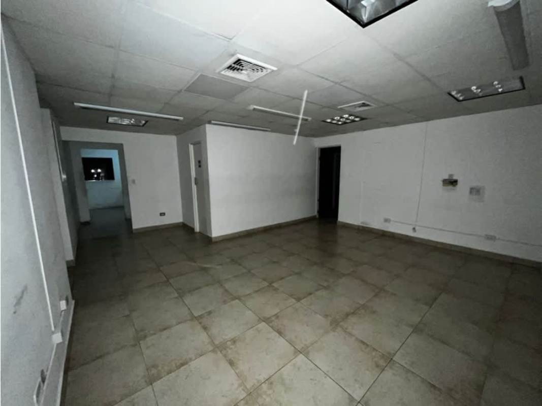 Minimalist lobby area with large tiles and glass partitions inside Obarrio Business Center Panama