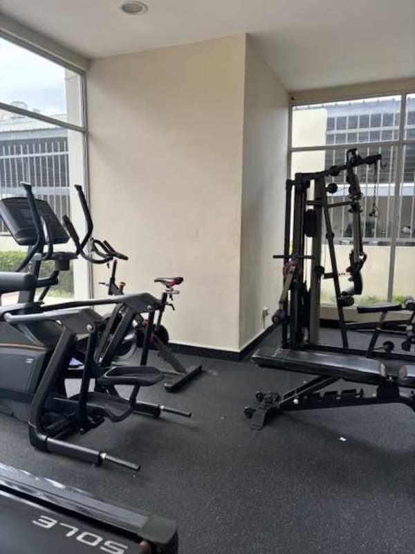 Modern gym with cardio machines at PH Rokas Condado del Rey Panama