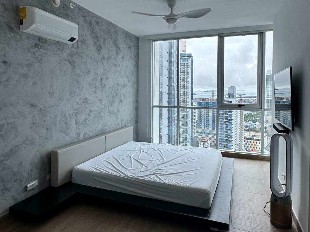 Luxury open kitchen with island, marble floors, stainless appliances at PH Bicsa Financial Center Panama