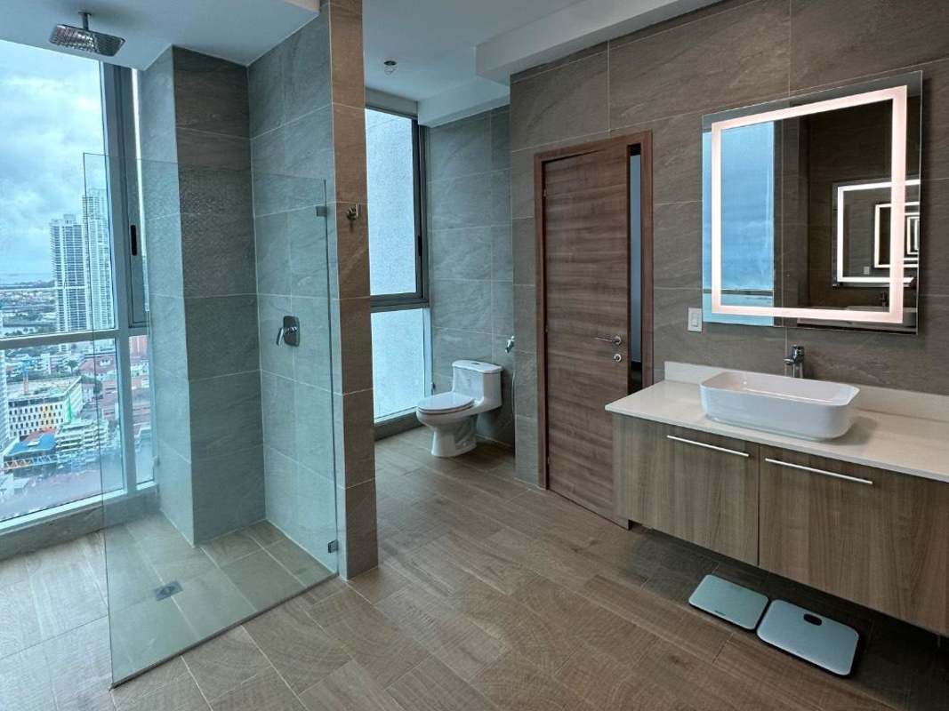 Modern open dining area and kitchen with floor-to-ceiling windows and city views PH Bicsa Tower Panama