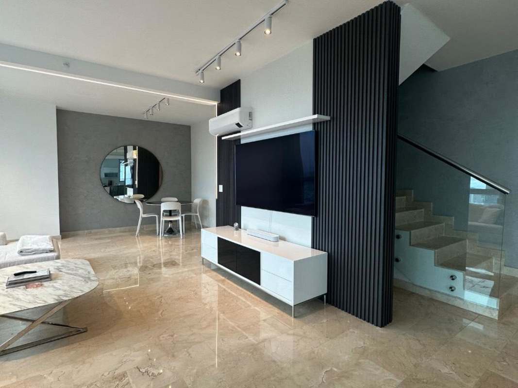 Modern bathroom with walk-in shower, large windows, marble finishes, skyline view in PH Bicsa Panama City