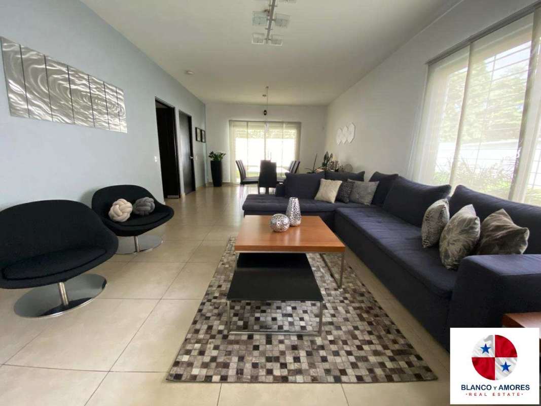 Spacious living and dining room with porcelain floors, large windows at Dorado Village Panama City