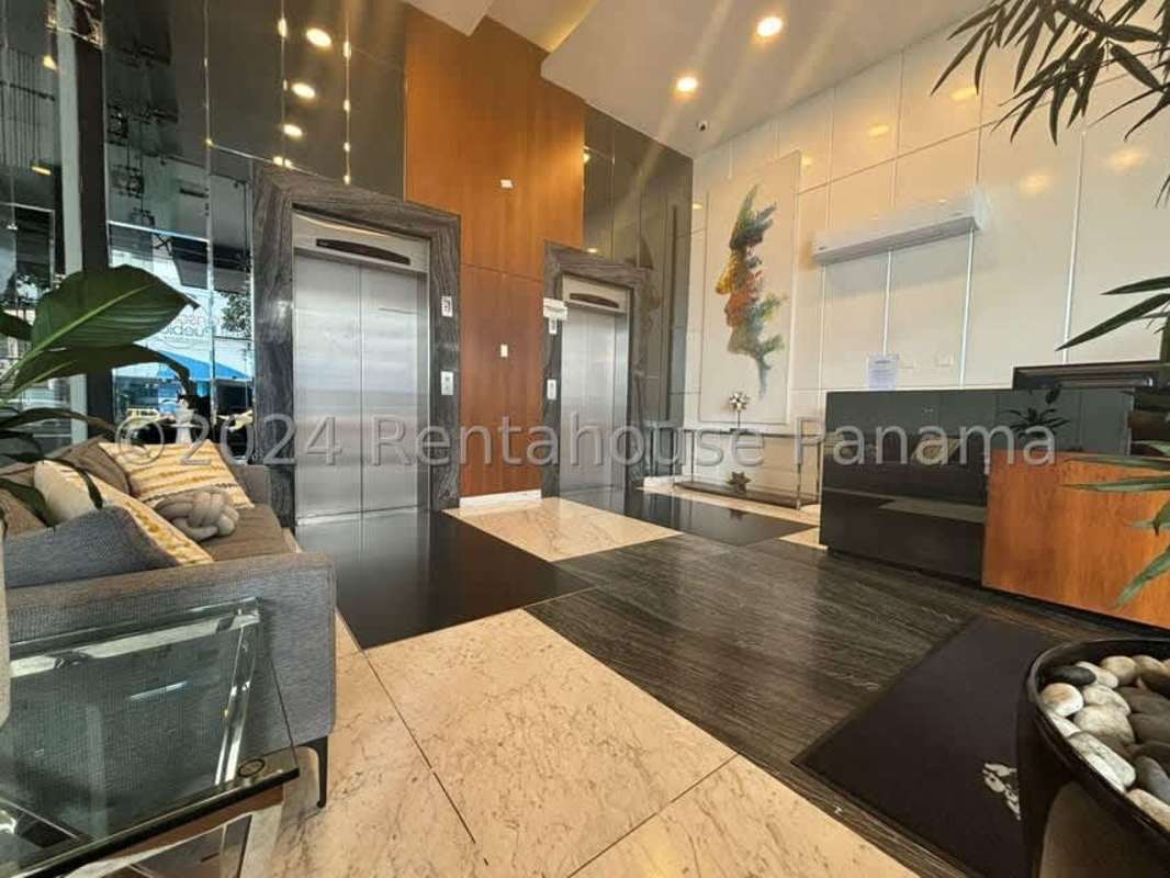 Contemporary tiled bathroom with glass shower enclosure in PH Vista Parque Panama City