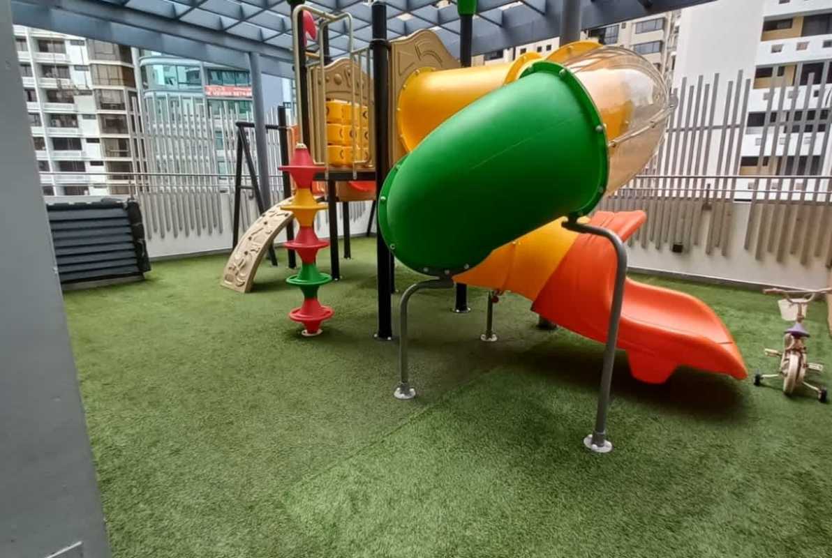 Colorful children's play area with slides rooftop terrace PH Deluxe Residences luxury condo Punta Paitilla Panama
