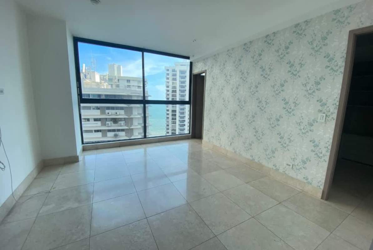 Large modern walk-in closet with built-in shelving in luxury PH Deluxe Residences Punta Paitilla Panama