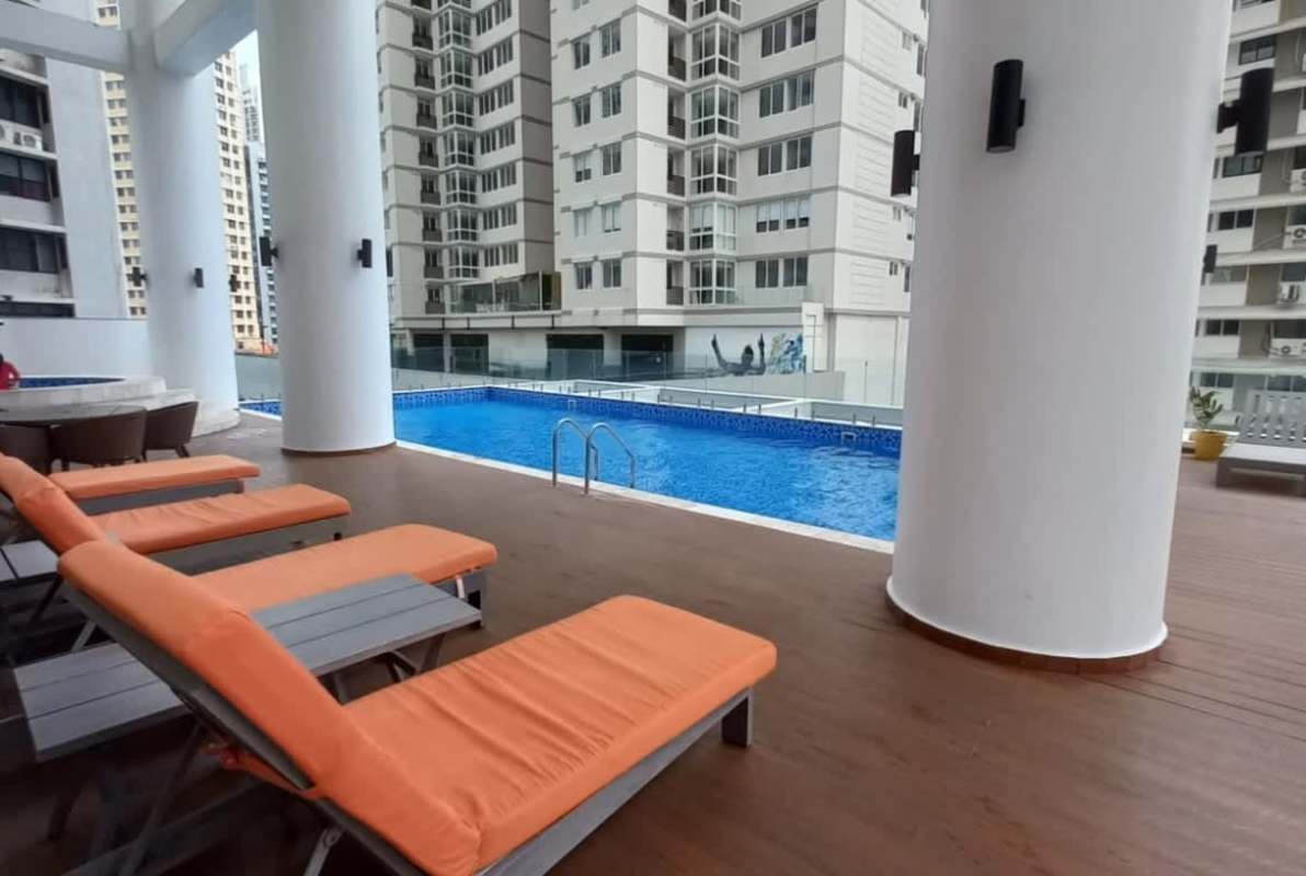 Bright modern living room with large sliding doors to balcony ocean view PH Deluxe Residences Punta Paitilla Panama
