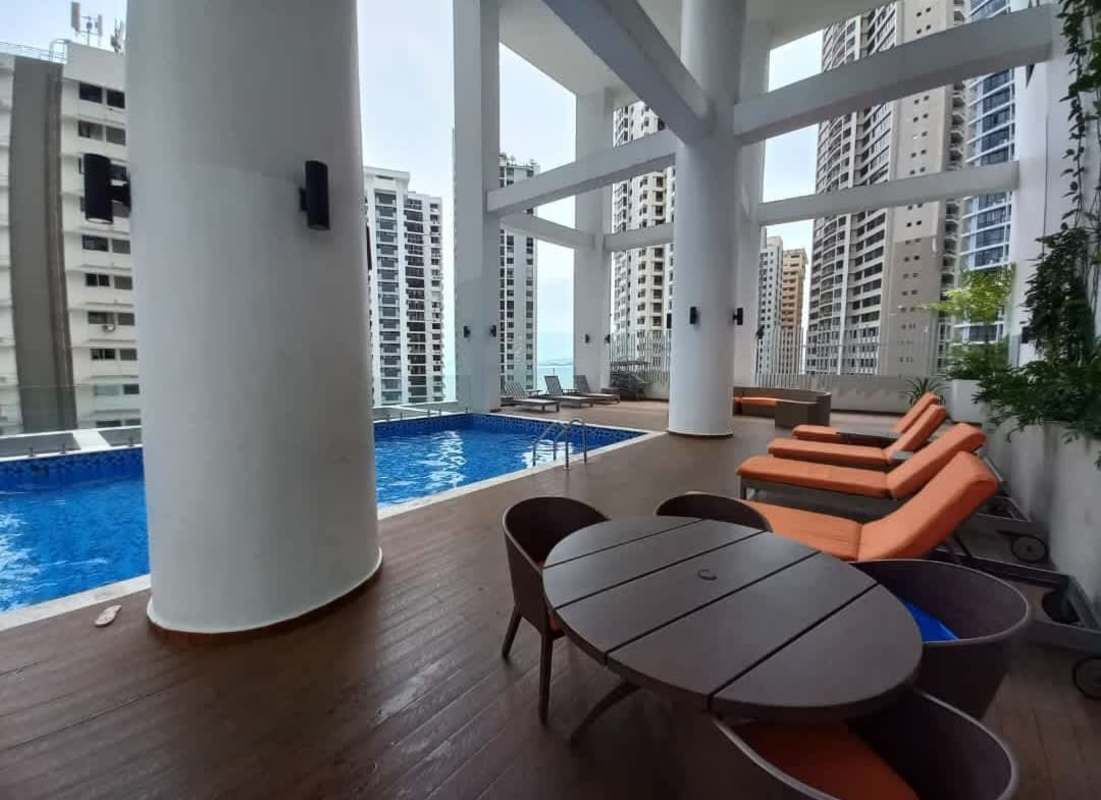 Modern gym with exercise machines and weights PH Deluxe Residences luxury tower Punta Paitilla Panama