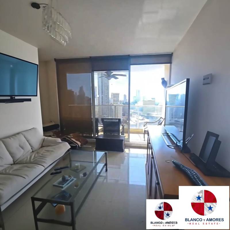Spacious living room with glass doors and skyline views in PH Blanco y Amores Obarrio Panama