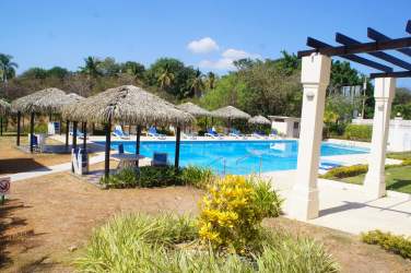 Panoramic rooftop infinity pool and lounge chairs overlooking Coronado beach at PH Coronado Golf