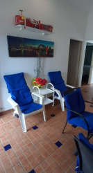 Covered porch with BBQ and view of gardens at Costa Grande Beach Residences Nueva Gorgona Panama