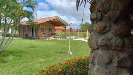 Single story ranch style house with large lawn and covered porch in Playa Gorgona Panama
