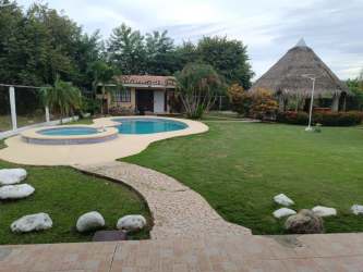 Resort style backyard with swimming pool jacuzzi palapa hut and garden at Playa Malibu Gorgona Panama