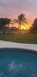 Jacuzzi spa pool in lush garden setting at sunset at Playa Malibu Gorgona Panama