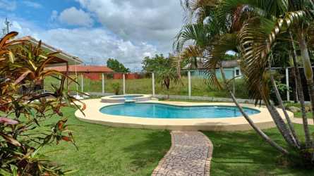 Backyard with private pool, jacuzzi hot tub, tropical trees and paved walkways Gorgona Panama