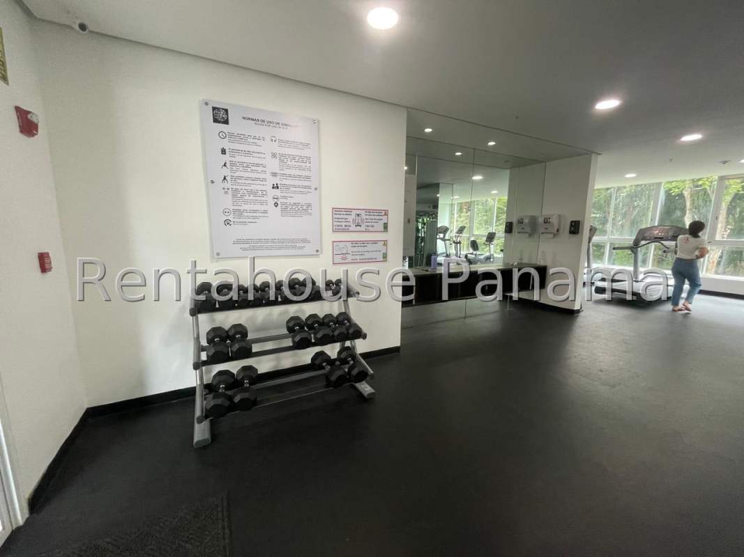 Well-equipped gym with cardio machines and weights in Clayton Panama apartments
