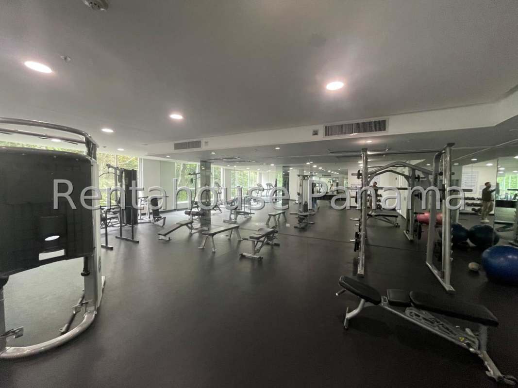 American-style kitchen with granite countertops, white cabinets in Clayton Residences Panama