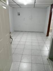 Simple bathroom with toilet, pedestal sink, and walk-in shower at Caseres Panama apartment