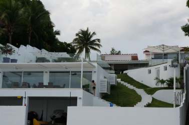 Beachfront tropical landscape private villa Costa Esmeralda Panama palm trees pool ocean